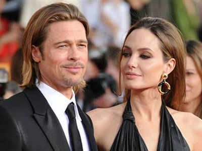 Angelina’s kids drawings sewn on her wedding gown