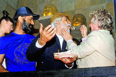 Rohit Bal surprised Sunil Sethi with a cake during Wills Lifestyle India Fashion Week in Delhi