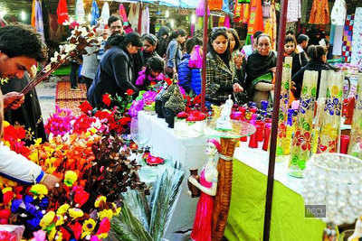 Delhiites enjoy during Winter Carnival and Christmas festival at Dilli Haat in Delhi