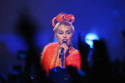 Miley Cyrus: Miley Cyrus goes topless while playing in the ocean