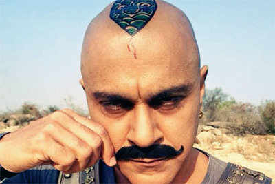 Baba Sehgal inks a snake tattoo