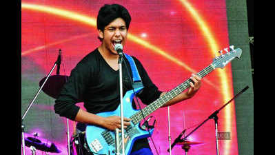 Aditya performs with his rock band during annual function of an engineering college in Kanpur