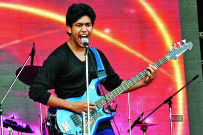 Aditya performs with his rock band during annual function of an engineering college in Kanpur