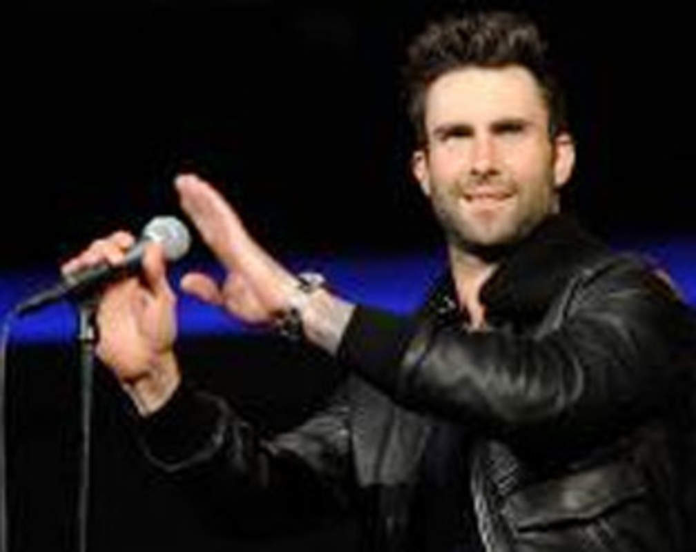 
Adam Levine hits female fan on head with his microphone
