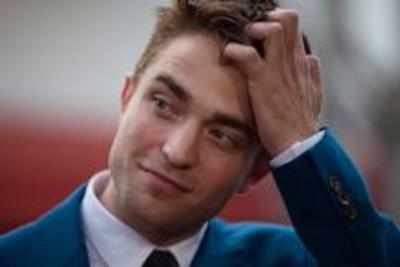 Robert Pattinson pushes a fan?