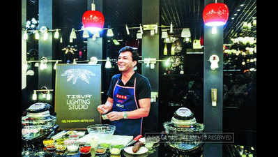 Masterchef Vikas Khanna prepares a fine gourmet at the launch of Usha International's TISVA The Lighting Studio in Mumbai