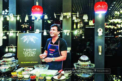 Masterchef Vikas Khanna prepares a fine gourmet at the launch of Usha International's TISVA The Lighting Studio in Mumbai