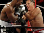 Former Massachusetts Governor and two-time presidential candidate Mitt Romney (R) fights five-time heavyweight champion Evander Holyfield- Photogallery - Times of India
