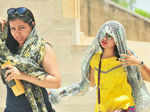 Girls try to cover themselves with scarfs Photogallery - Times of India