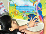 A girl paints on themes related to environment Photogallery - Times of India