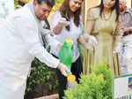 Sundeep Bhutoria watering a plant along with Shalu Mangal and Vinnie Kakkar Photogallery - Times of India