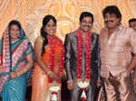 Vidharth and Gayathri Devi pose with guests during their wedding