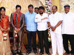 Gayathri Devi pose with guests during their wedding reception