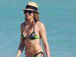 Katie Cassidy hits the waves in camouflage bikini