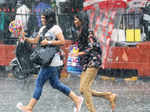 Commuters rush to hide from heavy rains