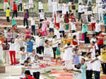 Attendees take part in a mass yoga session