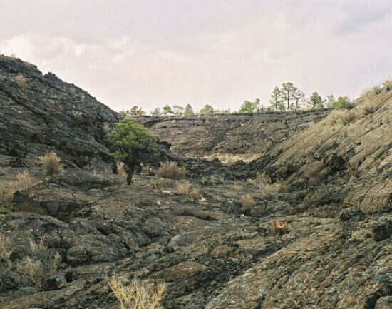 Walking across
volcanic badlands in the footsteps of ancient Americans
