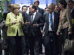 German Chancellor Angela Merkel (L) talks with French President