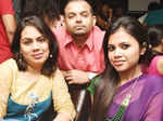 Priya, Nash and Risha pose for a photo during a party