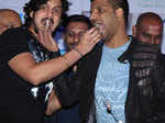 Krishna Ajai Rao and Sathish Neenasam feed each other cake at the audio launch of Rocket