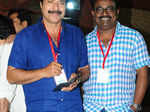 Mammooty poses with a guest during the General body meeting