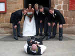 A photographer takes a funny shot of a newly married couple