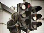 Photographer climbs on the traffic light