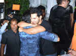 Varun Dhawan greets Sidharth Malhotra as he arrives for a party
