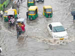 Traffic moves slowly at waterlogged roads near New Delhi