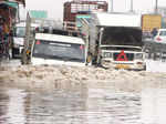 Traffic moves slowly at waterlogged roads in New Delhi