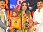 Nandamuri Balakrishna and Chiranjeevi present an award to Mahi Gill