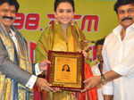 Nandamuri Balakrishna and Chiranjeevi present an award to Rakul Preet Singh