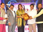 Lakshmi Manchu receives an award during TSR TV9 National Film Awards