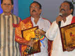 T Subbarami Reddy poses with winners during TSR TV9 National Film Awards