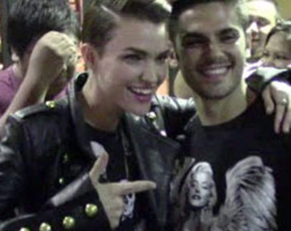 
Ruby Rose poses with fans
