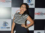 A guest poses on her arrival for the screening of Marathi movie Jaaniva