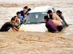 Heavy rains trigger floods in east, west India