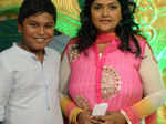 Nirosha poses with a guest during the staging of a play, Nadikavelin Raajapattai, in remembrance of MR Radha