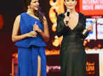 Amy Jackson (R) speaks after receiving an award as Lakshmi Manchi (L) looks on