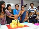 City's dog lovers cutting the cake