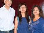Chetan, Sukhee and Susam pose for a photo during a photo exhibition