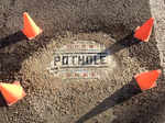 A picture of a pothole, which was mended by an artis