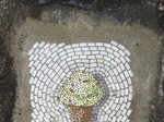 A picture of an ice cream cone was drawn on the pothole