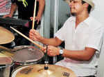 Nishant plays drums during a musical night