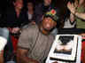Retired American basketball player Dennis Rodman poses with a cake