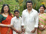 Sarathkumar (2R) and Radhika (R) pose with guests as they arrive for the wedding ceremony