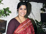 Renuka Shahane smiles for a photo on her arrival