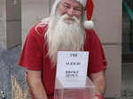 A beggar dons Santa outfit to impress people