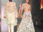 Models showcase creations by designers Abu Jani and Sandeep Khosla