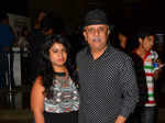 Rajesh Puri poses with a guest during the special screening